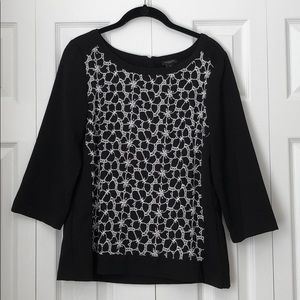 Ann Taylor black top with white embroidery detail